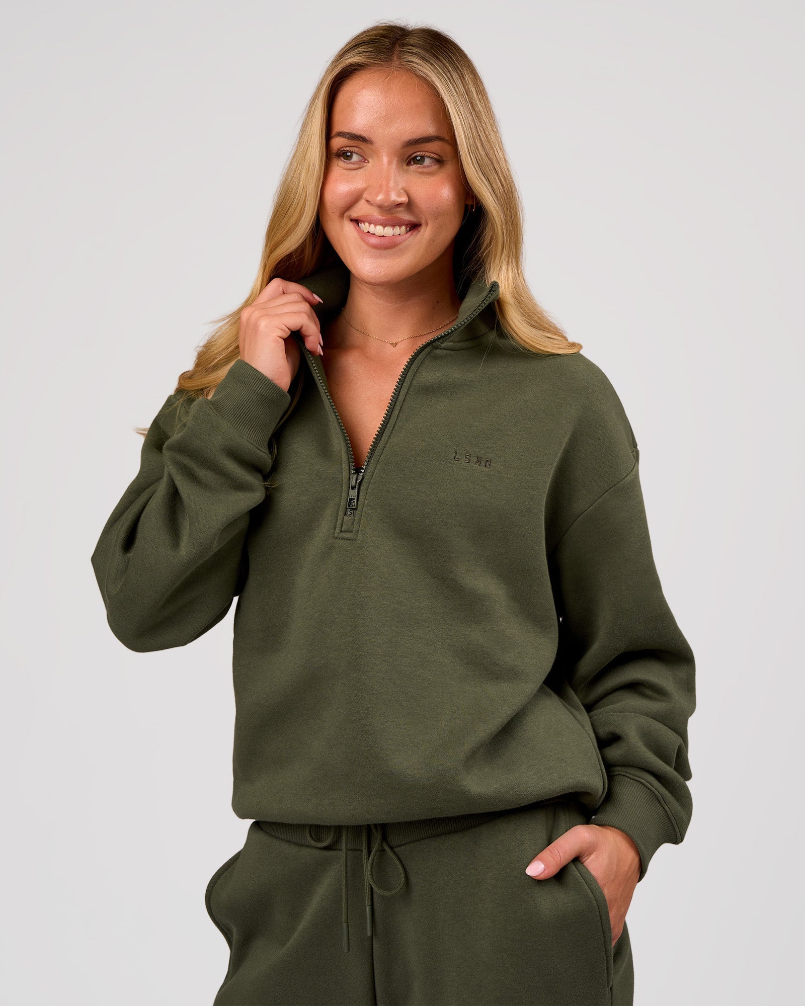 Woman wearing Go-To Oversized Quarter Zip Sweater - Pure Olive | Model:Issy | Size:XS
