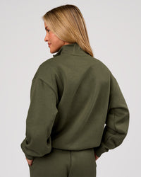 Woman wearing Go-To Oversized Quarter Zip Sweater - Pure Olive | Model:Issy | Size:XS | Thumbnail Index: 2