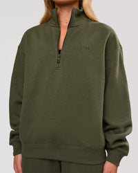 Woman wearing Go-To Oversized Quarter Zip Sweater - Pure Olive | Model:Issy | Size:XS | Thumbnail Index: 3