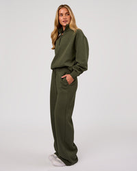 Woman wearing Go-To Oversized Quarter Zip Sweater - Pure Olive | Model:Issy | Size:XS | Thumbnail Index: 4