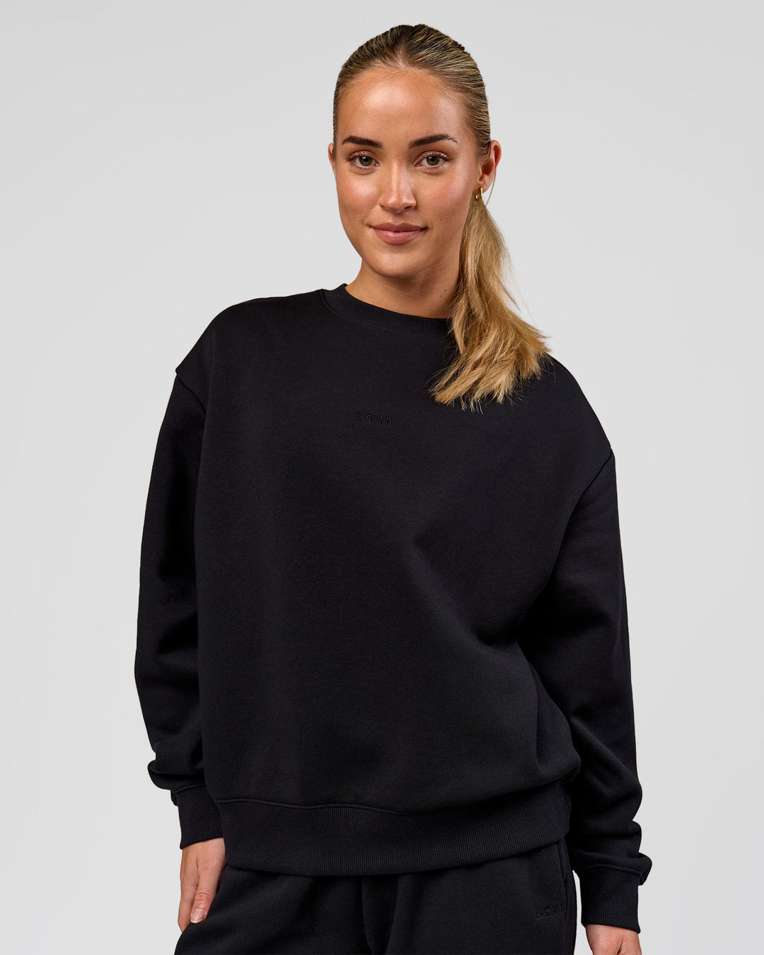 Woman wearing Go-To Oversized Sweater - Black | Model:Issy | Size:XS - view 1