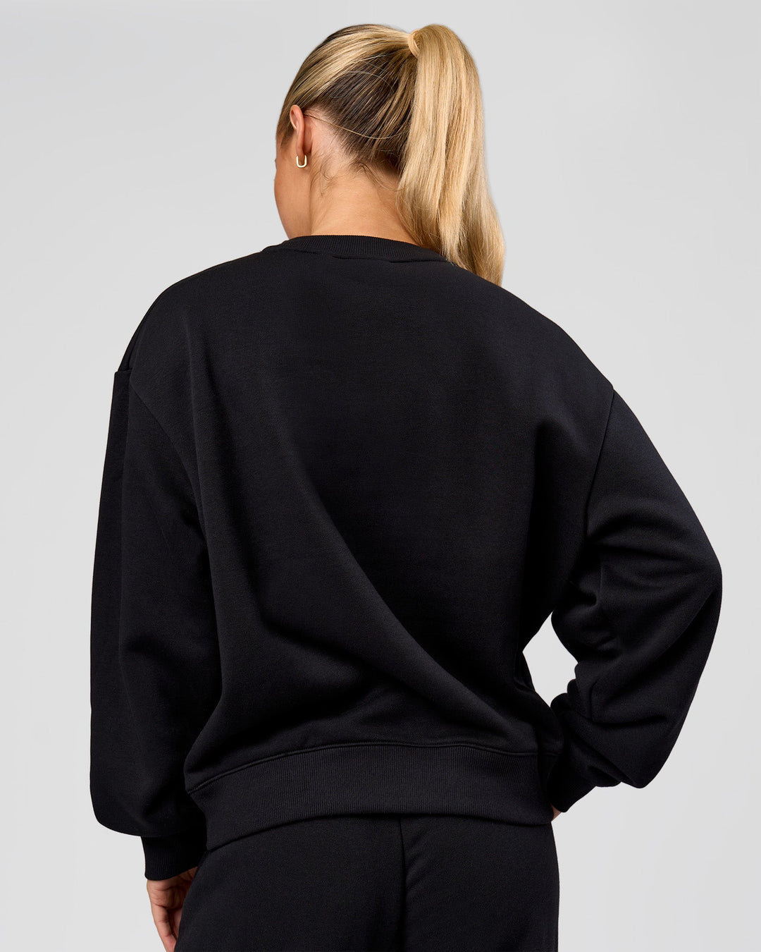 Woman wearing Go-To Oversized Sweater - Black | Model:Issy | Size:XS - view 2