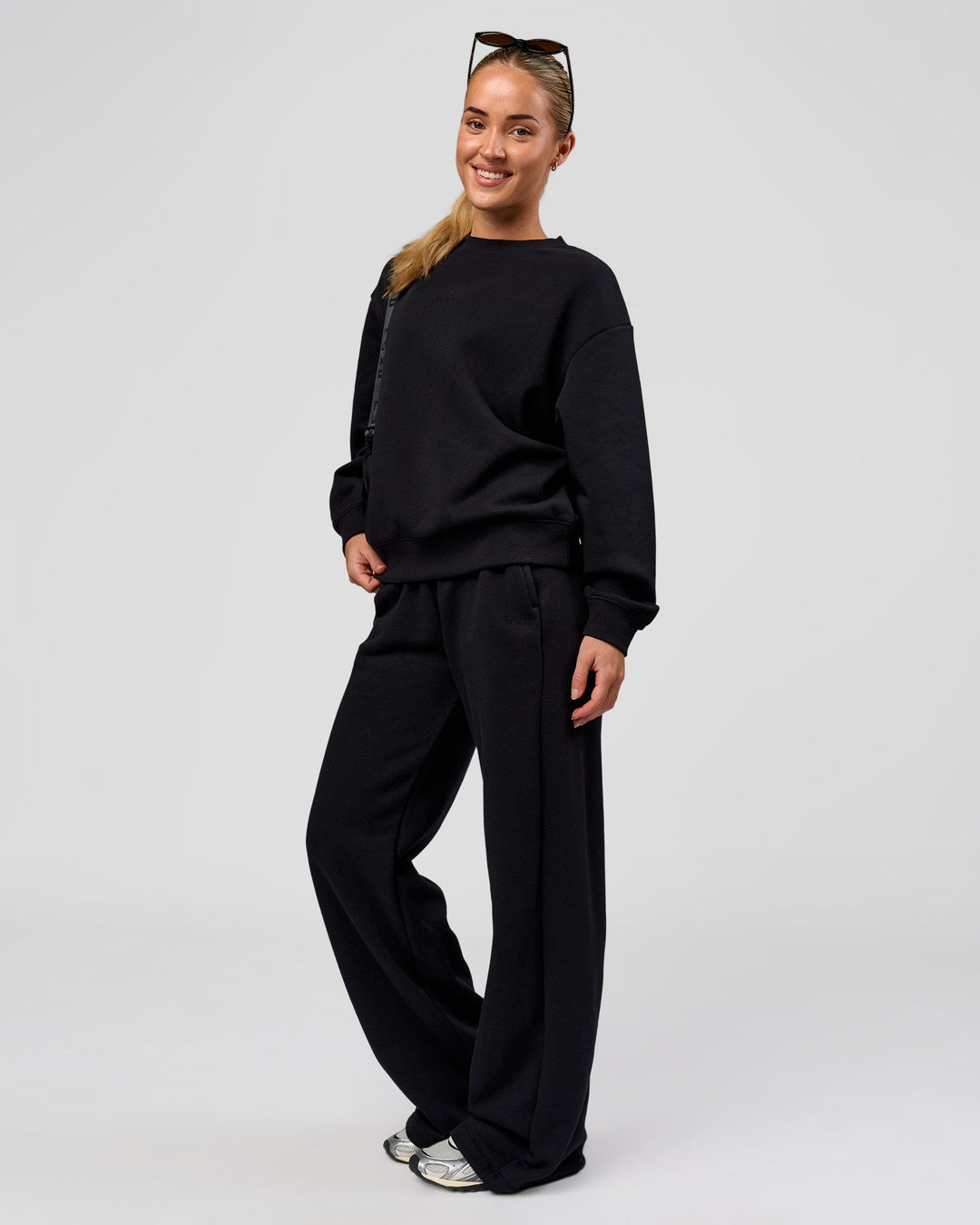Woman wearing Go-To Oversized Sweater - Black | Model:Issy | Size:XS - view 6