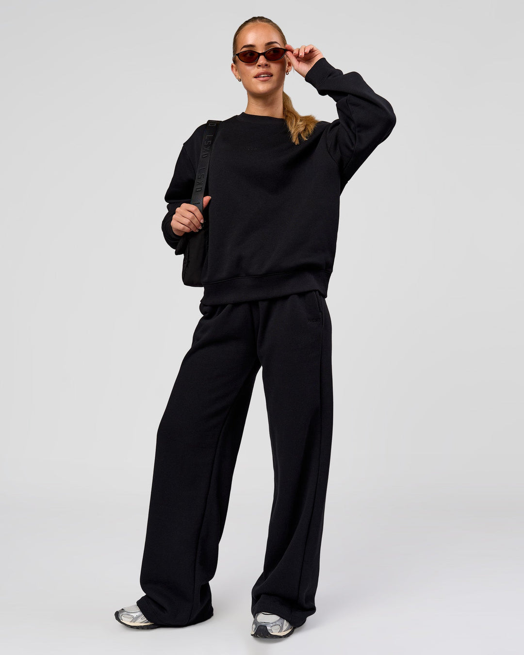 Woman wearing Go-To Oversized Sweater - Black | Model:Issy | Size:XS