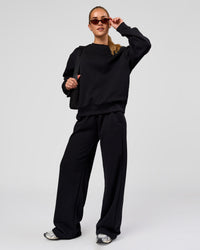 Woman wearing Go-To Oversized Sweater - Black | Model:Issy | Size:XS | Thumbnail Index: 2