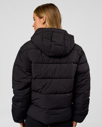 Woman wearing Go-To Puffer Jacket - Black | Model:Issy | Size:XS | Thumbnail Index: 1