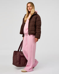 Woman wearing Go-To Puffer Jacket - Hot Chocolate | Model:Issy | Size:XS | Thumbnail Index: 12