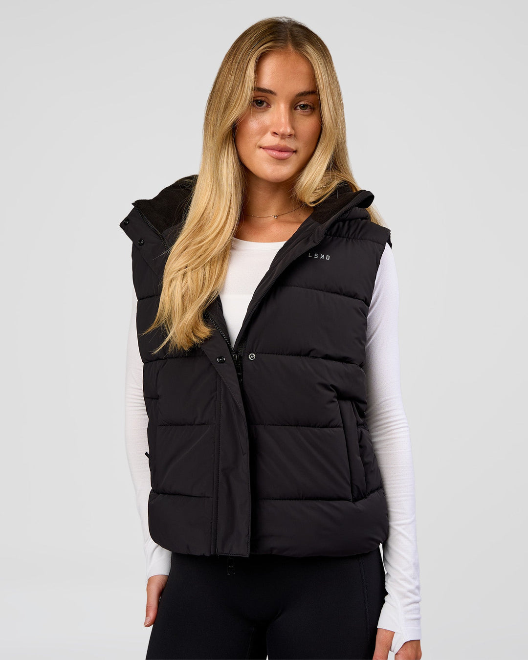 Woman wearing Go-To Puffer Vest - Black | Model:Issy | Size:XS - view 1