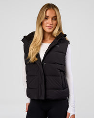 Woman wearing Go-To Puffer Vest - Black | Model:Issy | Size:XS