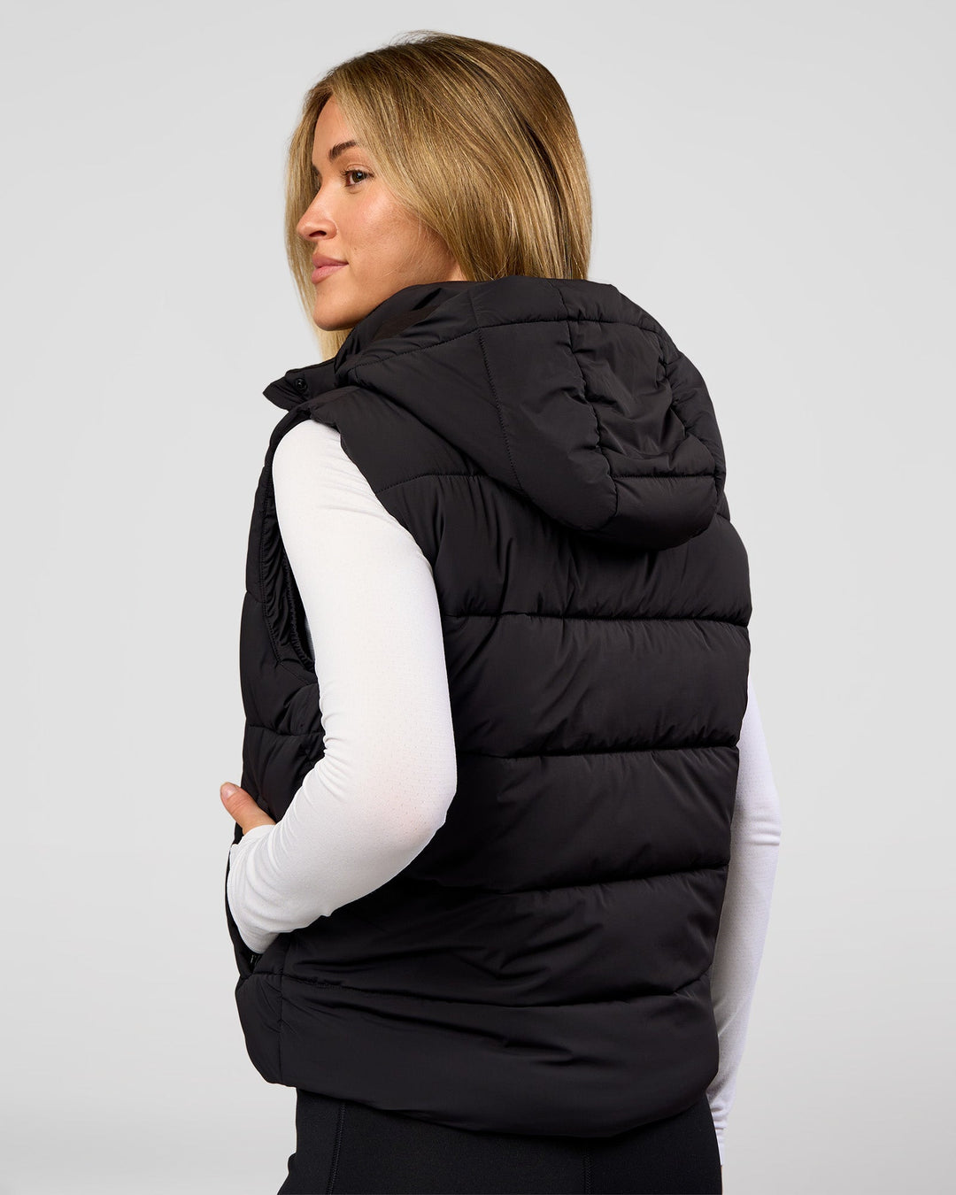 Woman wearing Go-To Puffer Vest - Black | Model:Issy | Size:XS - view 2