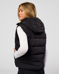 Woman wearing Go-To Puffer Vest - Black | Model:Issy | Size:XS | Thumbnail Index: 1