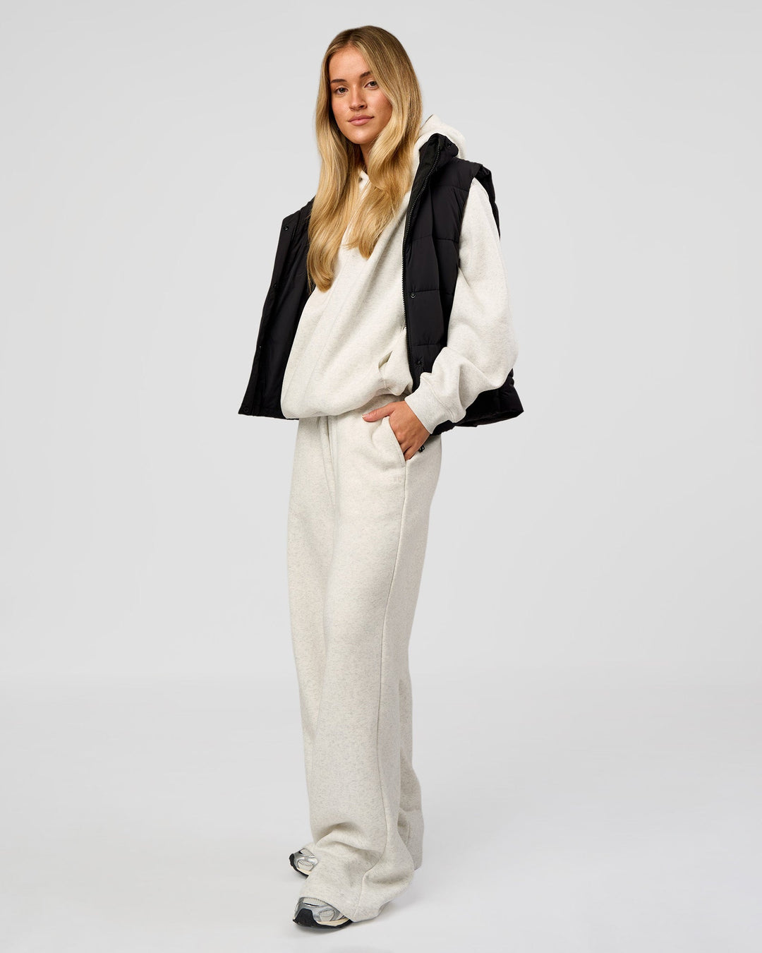 Woman wearing Go-To Puffer Vest - Black | Model:Issy | Size:XS - view 7
