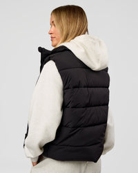 Woman wearing Go-To Puffer Vest - Black | Model:Issy | Size:XS | Thumbnail Index: 4