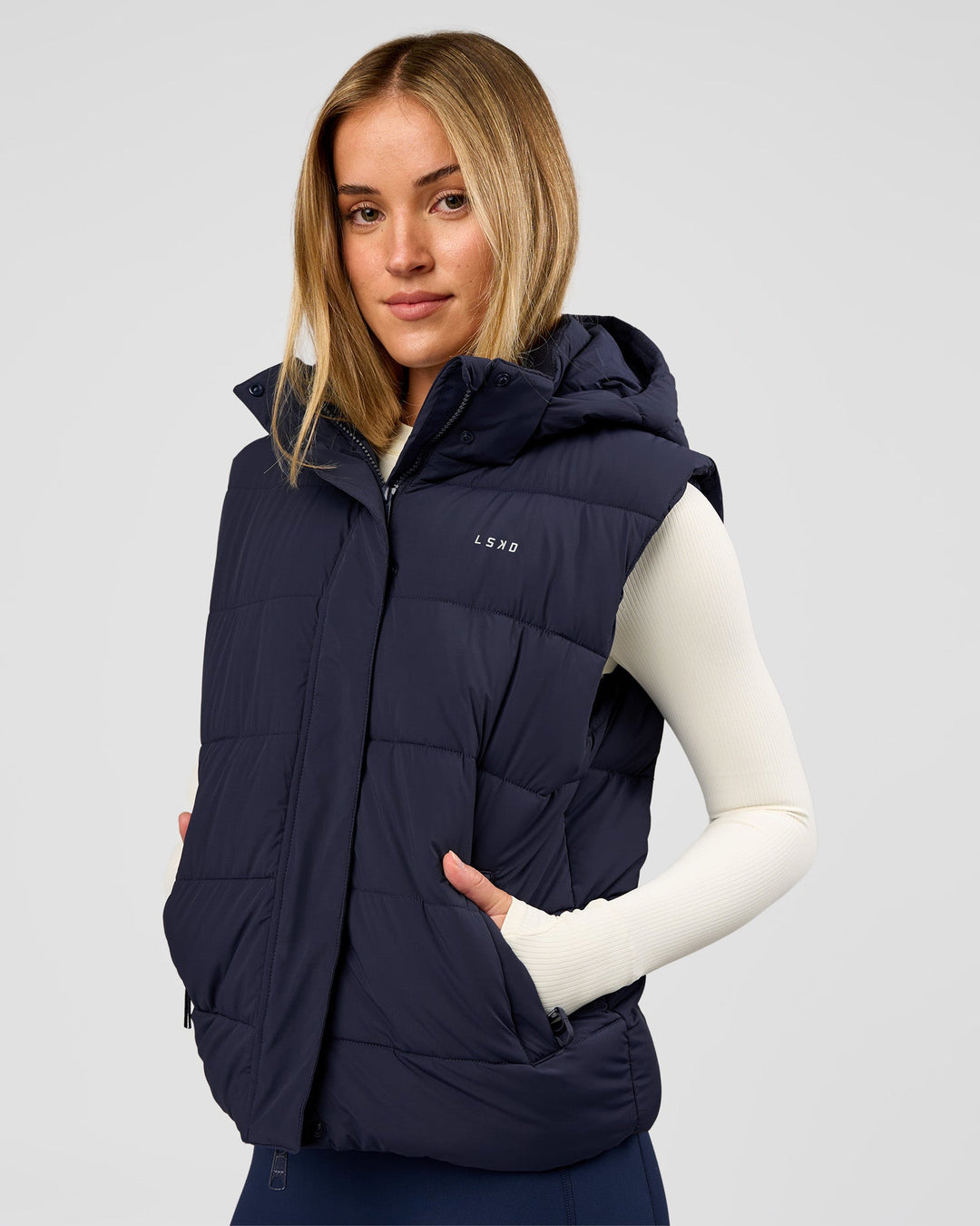 Woman wearing Go-To Puffer Vest - Future Navy | Model:Issy | Size:XS - view 1