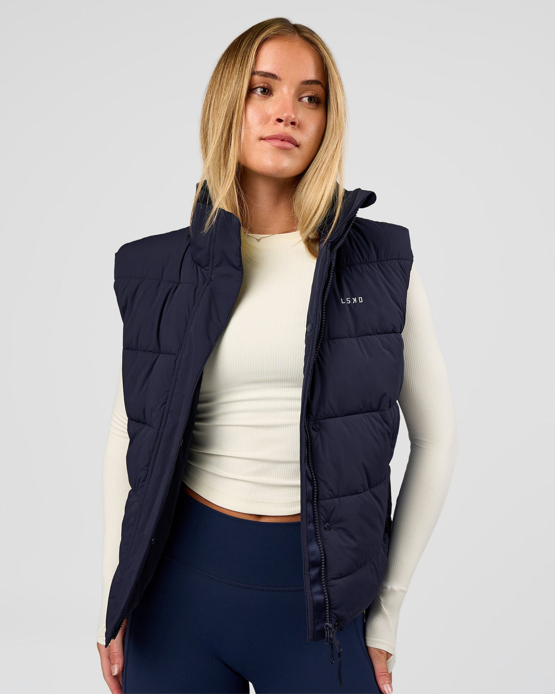 Woman wearing Go-To Puffer Vest - Future Navy | Model:Issy | Size:XS - view 2