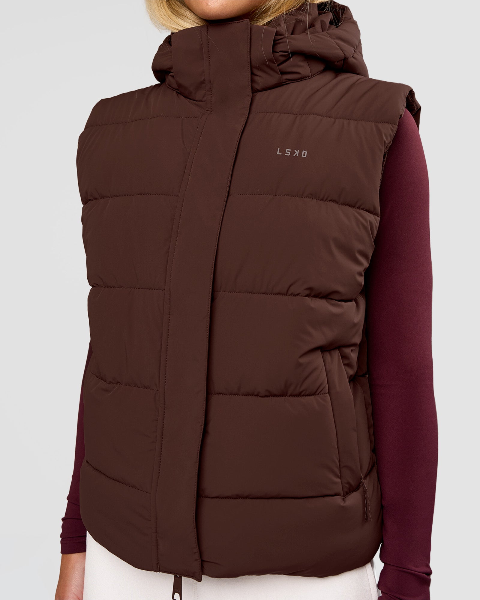 Woman wearing Go-To Puffer Vest - Hot Chocolate | Model:Issy | Size:XS