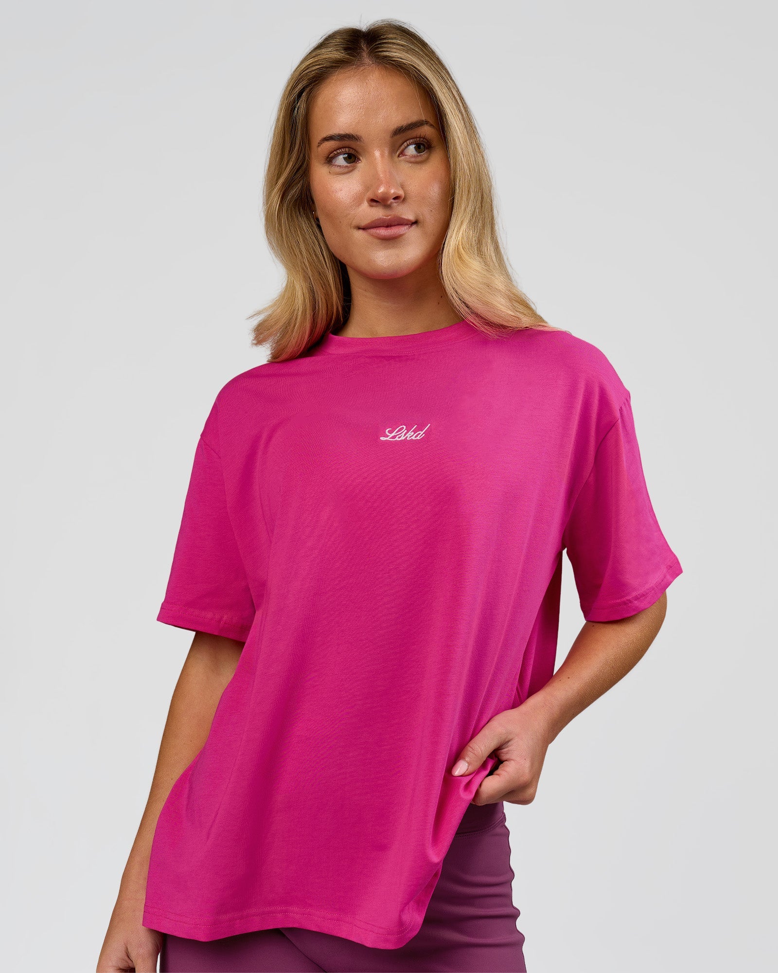 Woman wearing Go-To Script FLXCotton Oversized Tee - Ultra Pink-White | Model:Issy | Size:XS
