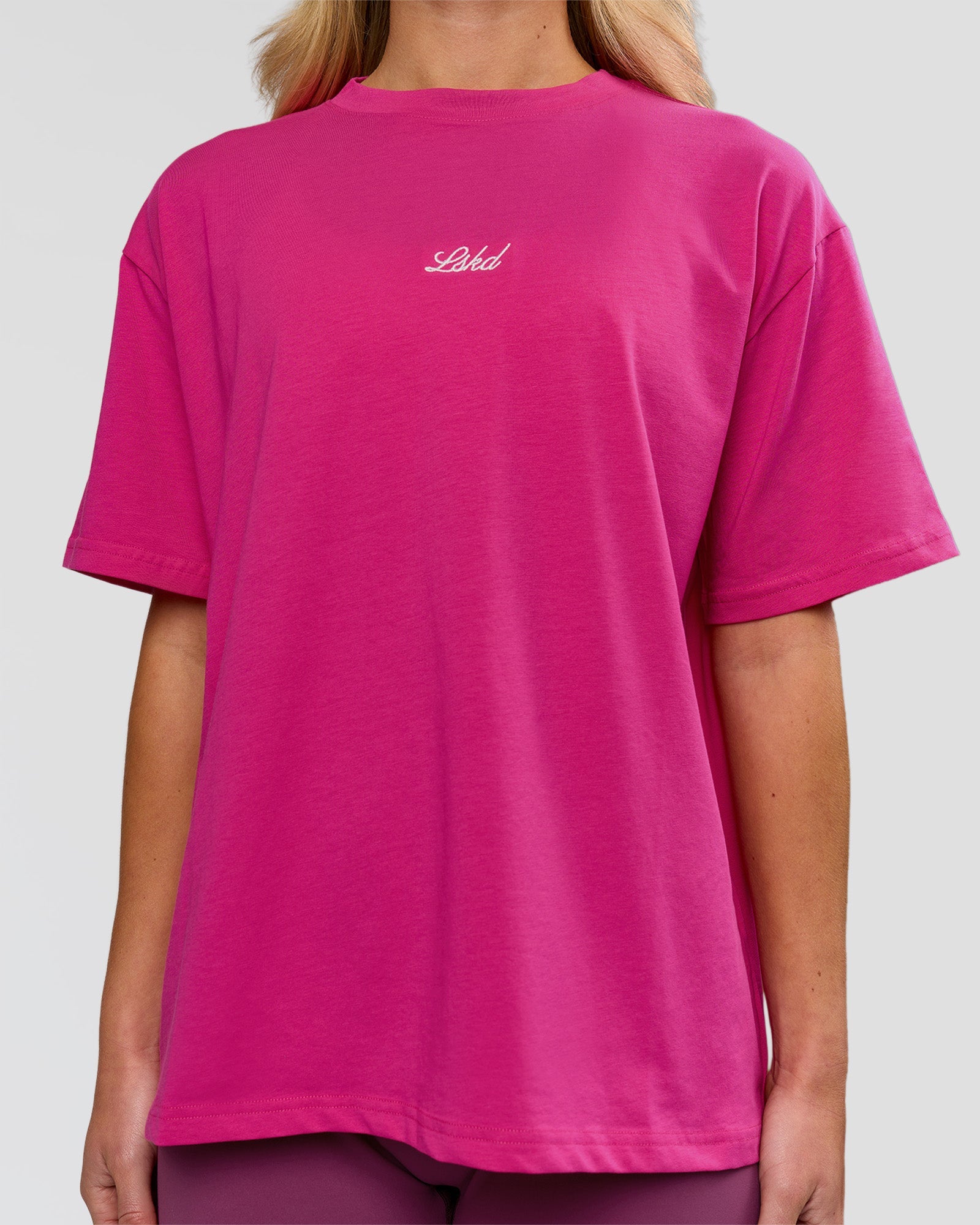 Woman wearing Go-To Script FLXCotton Oversized Tee - Ultra Pink-White | Model:Issy | Size:XS