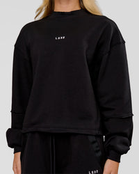 Woman wearing Go-To Terry Oversized Pull Over - Black-White | Model:Issy | Size:XS | Thumbnail Index: 1