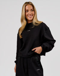 Woman wearing Go-To Terry Oversized Pull Over - Black-White | Model:Issy | Size:XS | Thumbnail Index: 2