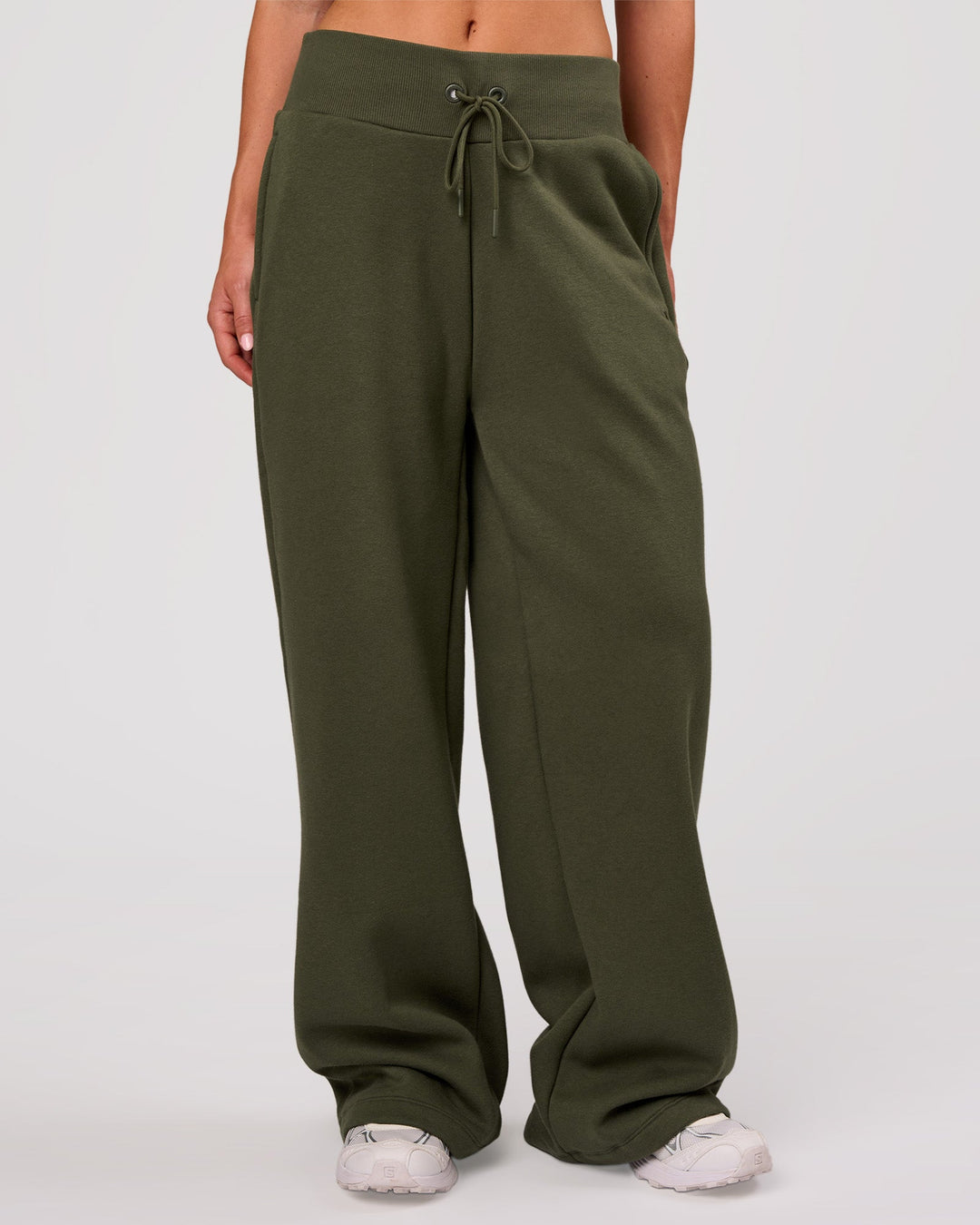 Woman wearing Go-To Wide Leg Track Pant - Pure Olive | Model:Issy | Size:XS - view 1