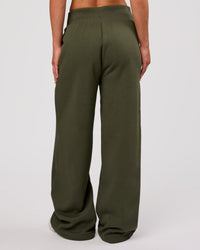 Woman wearing Go-To Wide Leg Track Pant - Pure Olive | Model:Issy | Size:XS | Thumbnail Index: 1