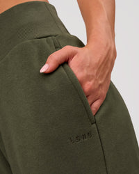 Woman wearing Go-To Wide Leg Track Pant - Pure Olive | Model:Issy | Size:XS | Thumbnail Index: 2