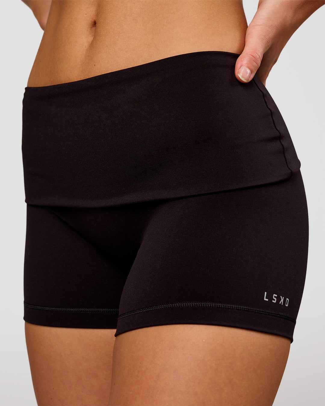 Woman wearing Groovy High Rise Fold Over 4" Short - Black | Model:Issy | Size:XS - view 1