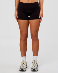 Woman wearing Groovy High Rise Fold Over 4" Short - Black | Model:Issy | Size:XS | Thumbnail Index: 2