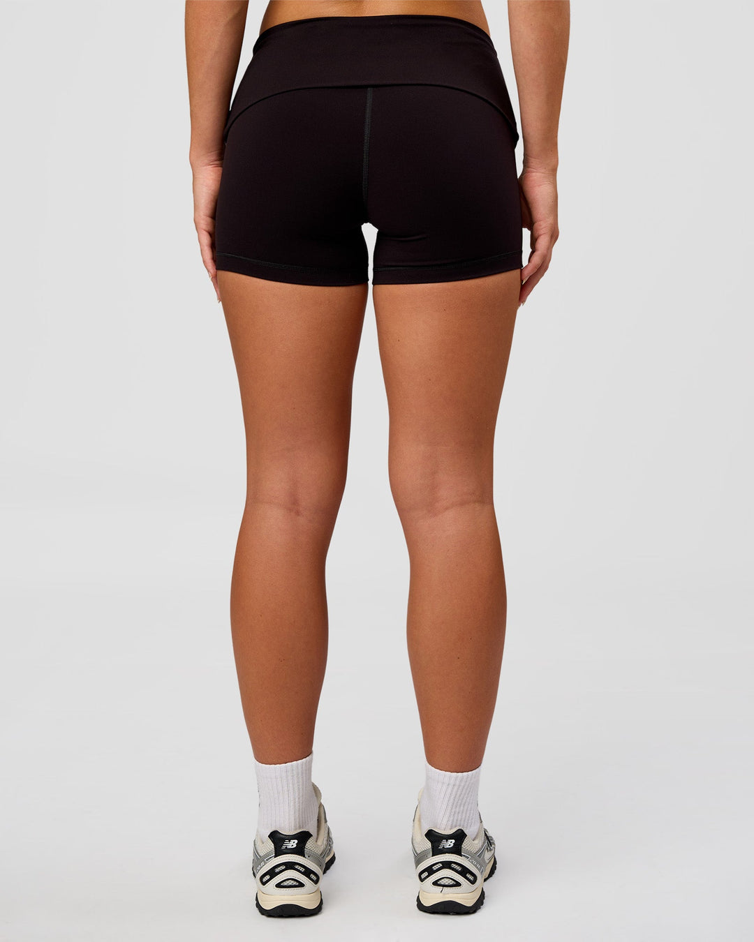 Woman wearing Groovy High Rise Fold Over 4" Short - Black | Model:Issy | Size:XS - view 8