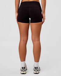Woman wearing Groovy High Rise Fold Over 4" Short - Black | Model:Issy | Size:XS | Thumbnail Index: 7