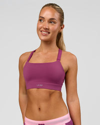 Woman wearing High Velocity Sports Bra - Boysenberry | Model:Issy | Size:XS | Thumbnail Index: 0