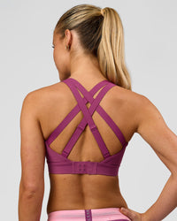 Woman wearing High Velocity Sports Bra - Boysenberry | Model:Issy | Size:XS | Thumbnail Index: 2