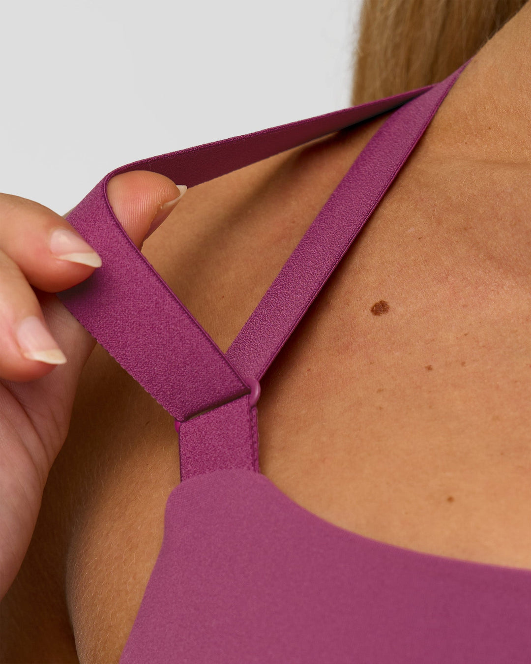 Woman wearing High Velocity Sports Bra - Boysenberry | Model:Issy | Size:XS - view 6