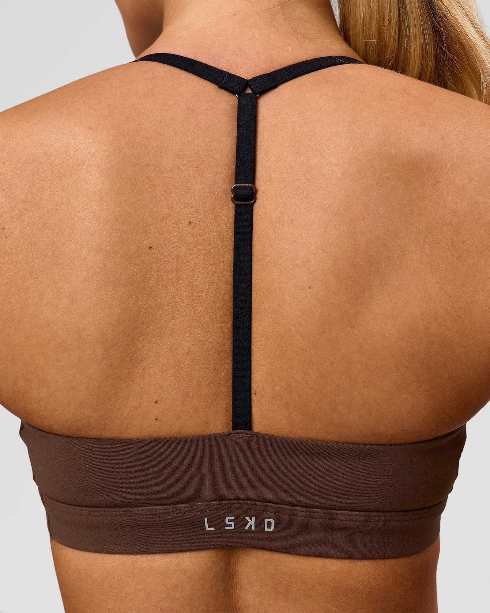 Woman wearing Infinity Sports Bra - Hot Chocolate | Model:Issy | Size:XS