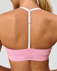 Woman wearing Infinity Sports Bra - Pink Rose | Model:Issy | Size:XS
