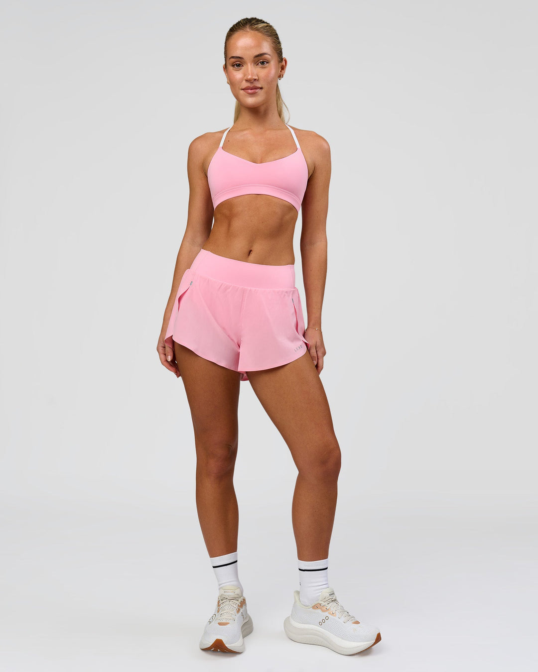 Woman wearing Infinity Sports Bra - Pink Rose | Model:Issy | Size:XS