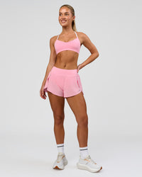 Woman wearing Infinity Sports Bra - Pink Rose | Model:Issy | Size:XS