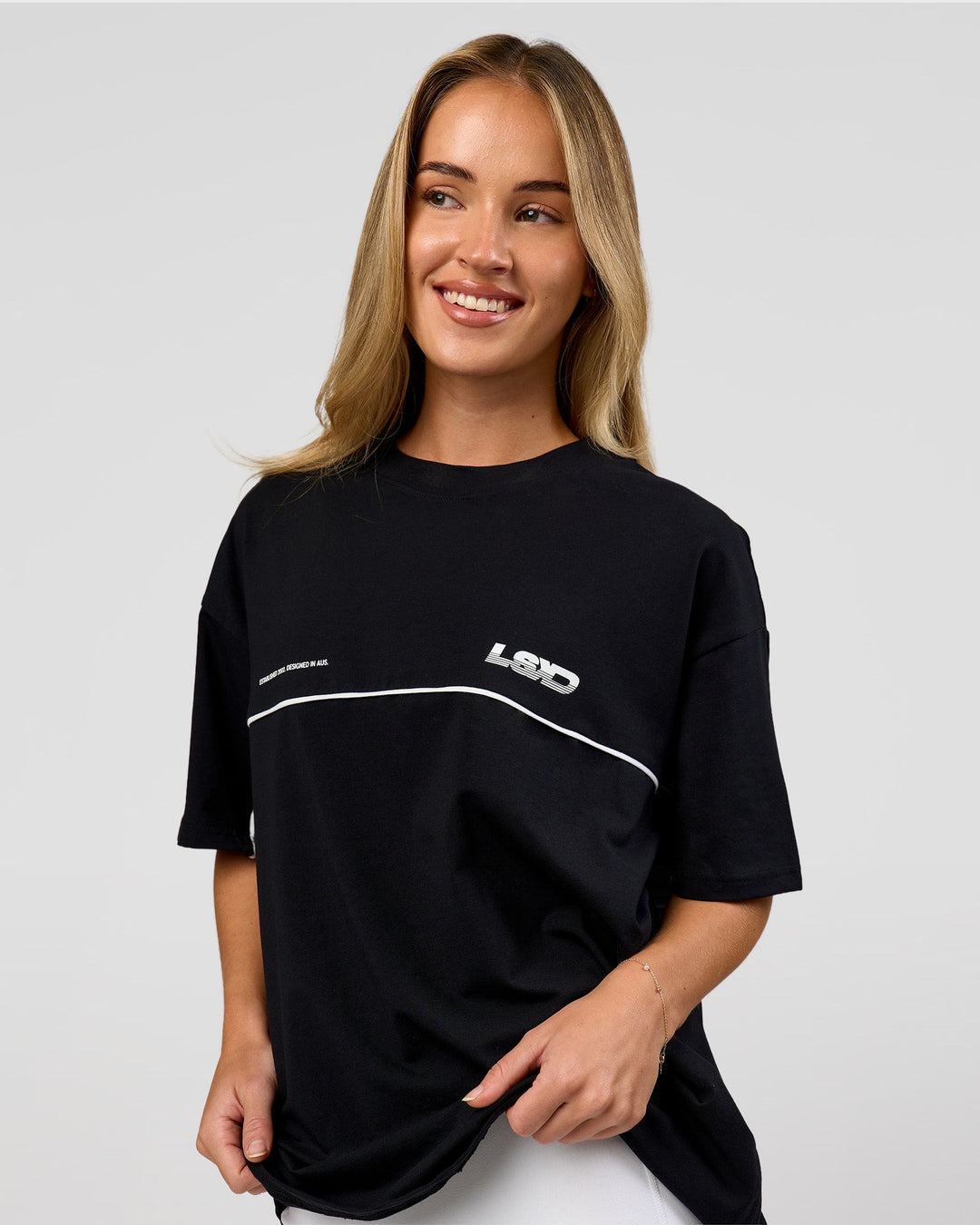 Woman wearing Inline Heavyweight FLXCotton Oversized Tee - Black-White | Model:Issy | Size:XS - view 6