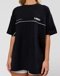 Woman wearing Inline Heavyweight FLXCotton Oversized Tee - Black-White | Model:Issy | Size:XS | Thumbnail Index: 8