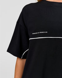 Woman wearing Inline Heavyweight FLXCotton Oversized Tee - Black-White | Model:Issy | Size:XS | Thumbnail Index: 14