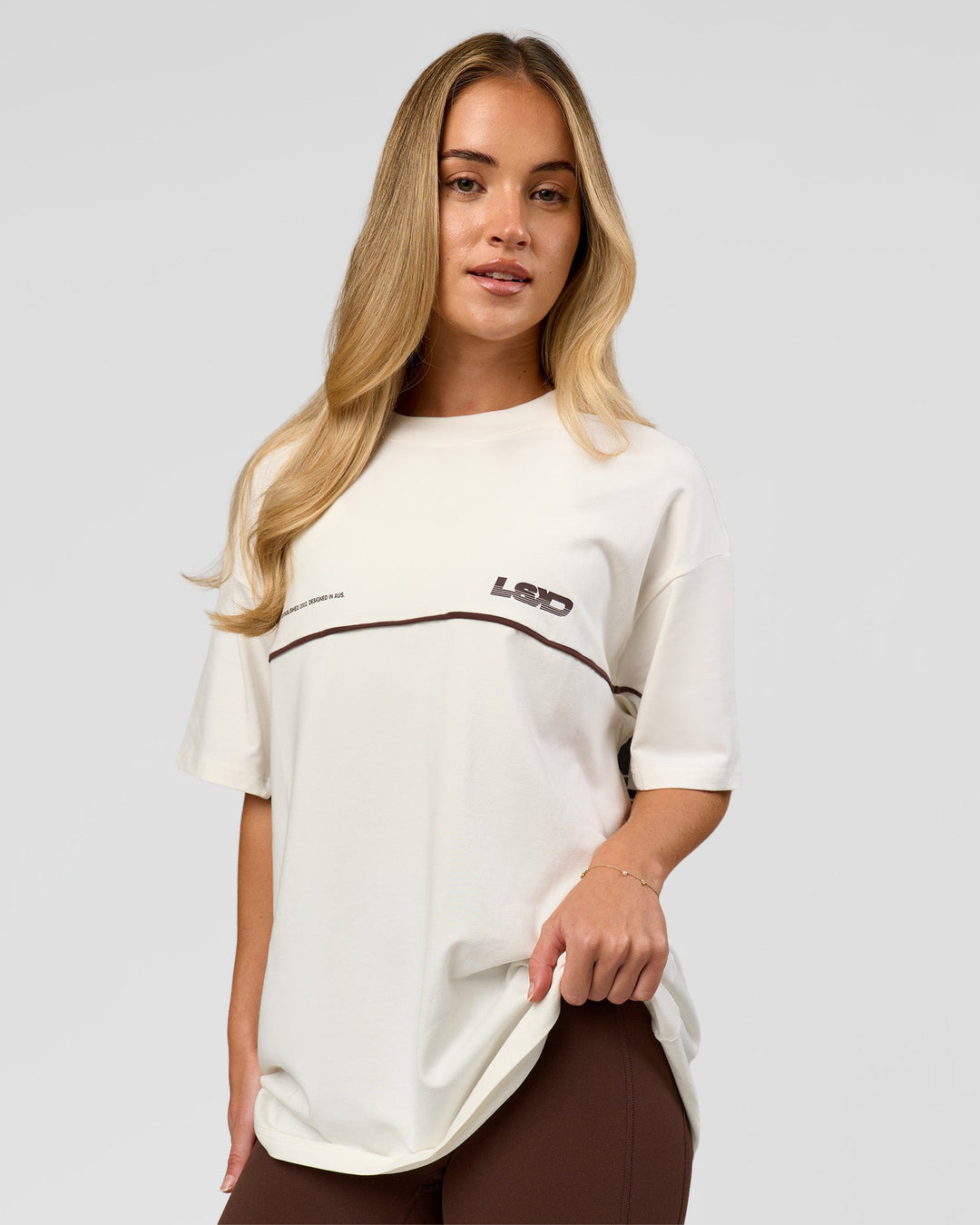 Woman wearing Inline Heavyweight FLXCotton Oversized Tee - Off White-Hot Chocolate | Model:Issy | Size:XS - view 9