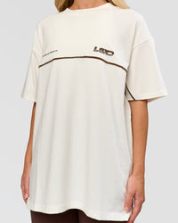 Woman wearing Inline Heavyweight FLXCotton Oversized Tee - Off White-Hot Chocolate | Model:Issy | Size:XS | Thumbnail Index: 10