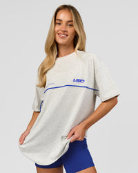 Woman wearing Inline Heavyweight FLXCotton Oversized Tee - Silver Marl-Power Cobalt | Model:Issy | Size:XS | Thumbnail Index: 8