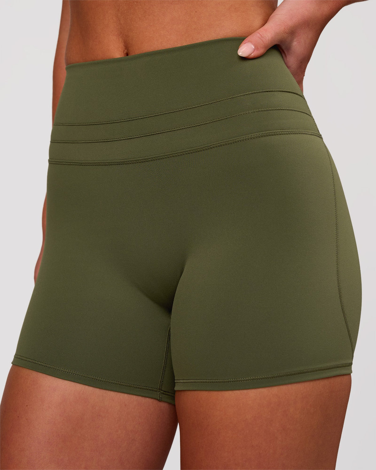 Woman wearing Luxe V-Contour High-Rise 4" Short - Pure Olive | Model:Issy | Size:XS - view 2