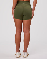 Woman wearing Luxe V-Contour High-Rise 4" Short - Pure Olive | Model:Issy | Size:XS | Thumbnail Index: 3