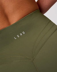 Woman wearing Luxe V-Contour High-Rise 4" Short - Pure Olive | Model:Issy | Size:XS | Thumbnail Index: 4