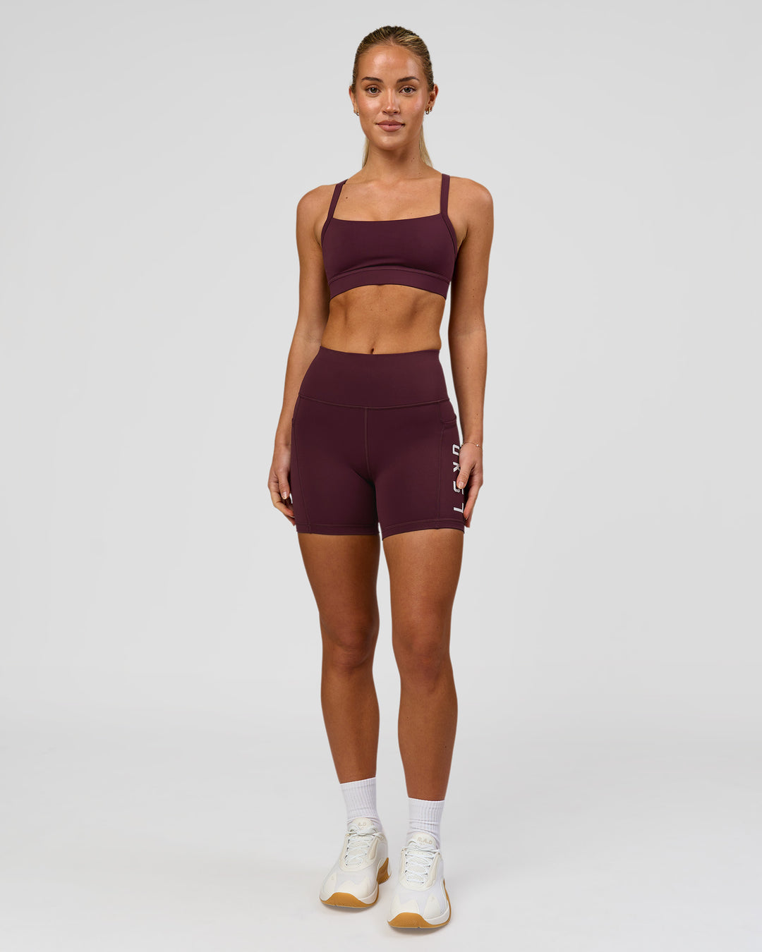Woman wearing Momentum Sports Bra - Cherry Lacquer | Model:Issy | Size:XS - view 4