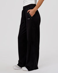 Woman wearing MVP Elite Terry Wide Leg Pant - Black-White | Model:Issy | Size:XS | Thumbnail Index: 1