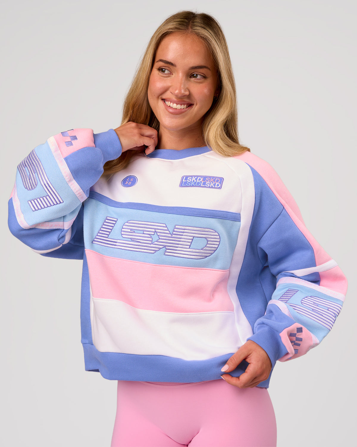Woman wearing Power Sweater - Pink Rose-Bluebell | Model:Issy | Size:XS